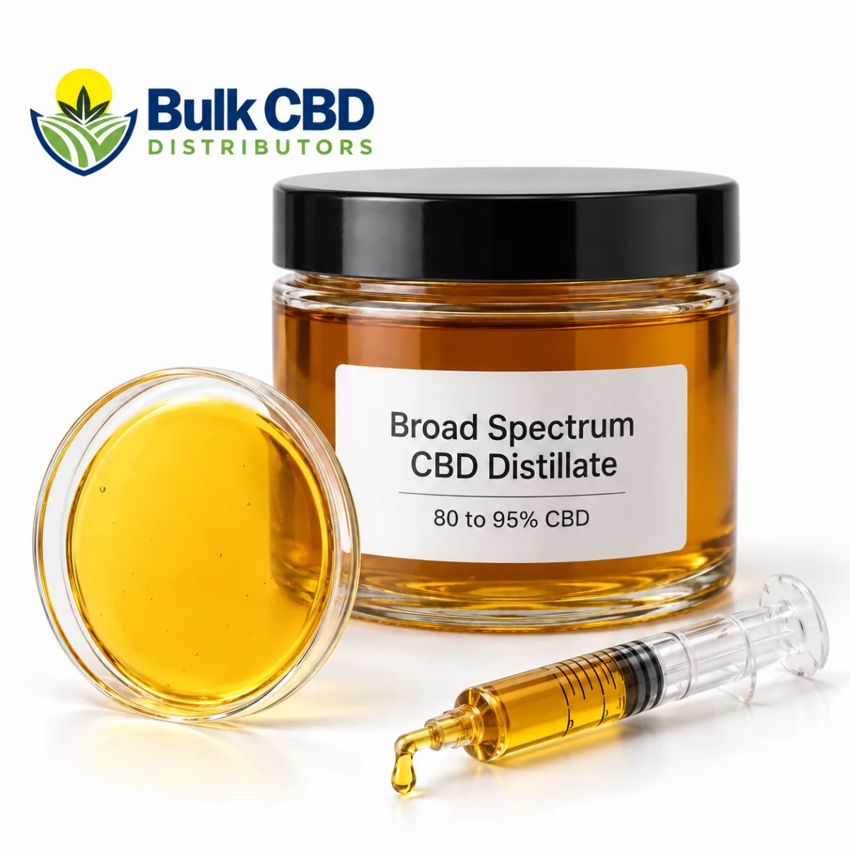 Glass jar of amber broad spectrum CBD distillate with a dish of the oil and a filled syringe